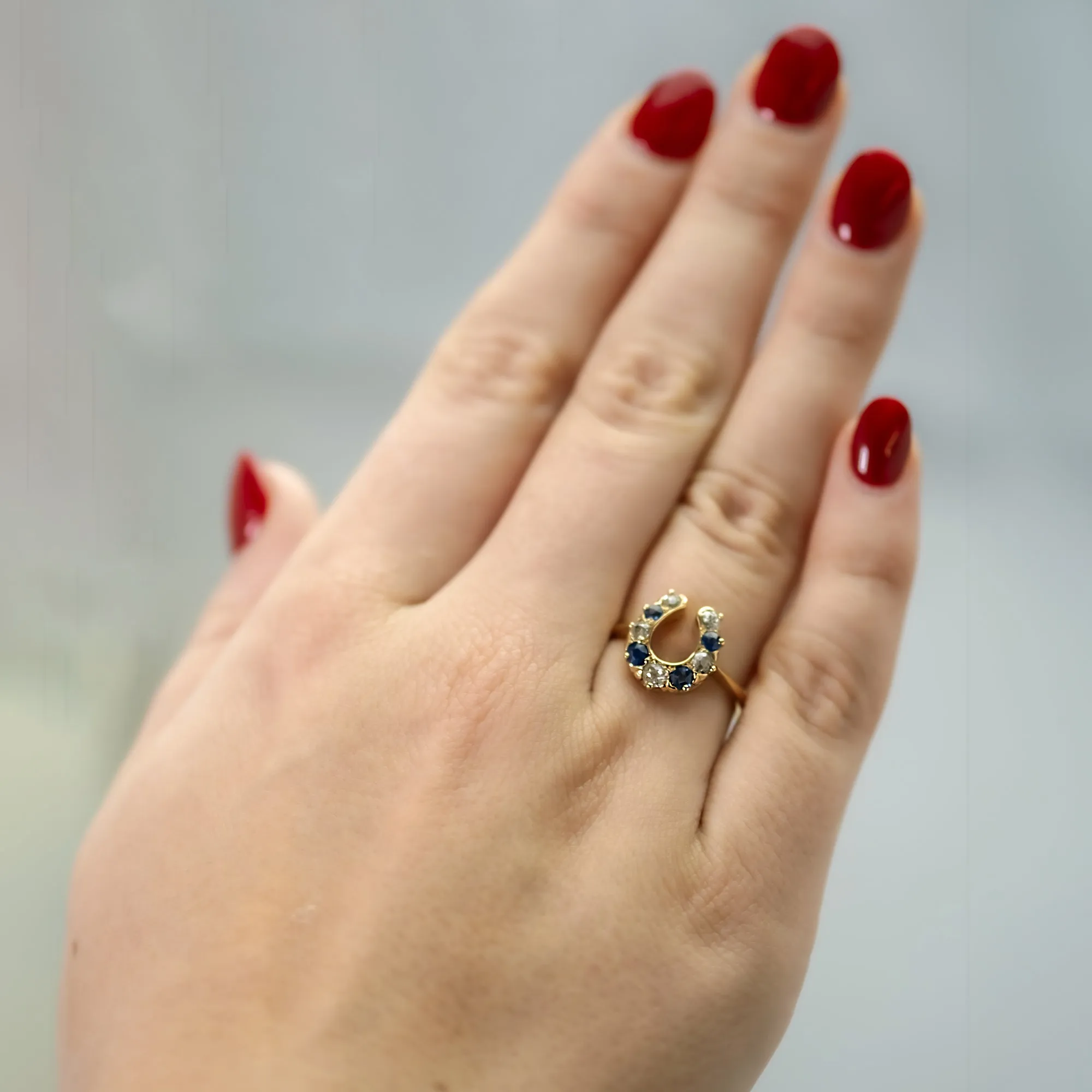 18 Carat Yellow Gold Sapphire and Diamond Horseshoe Ring