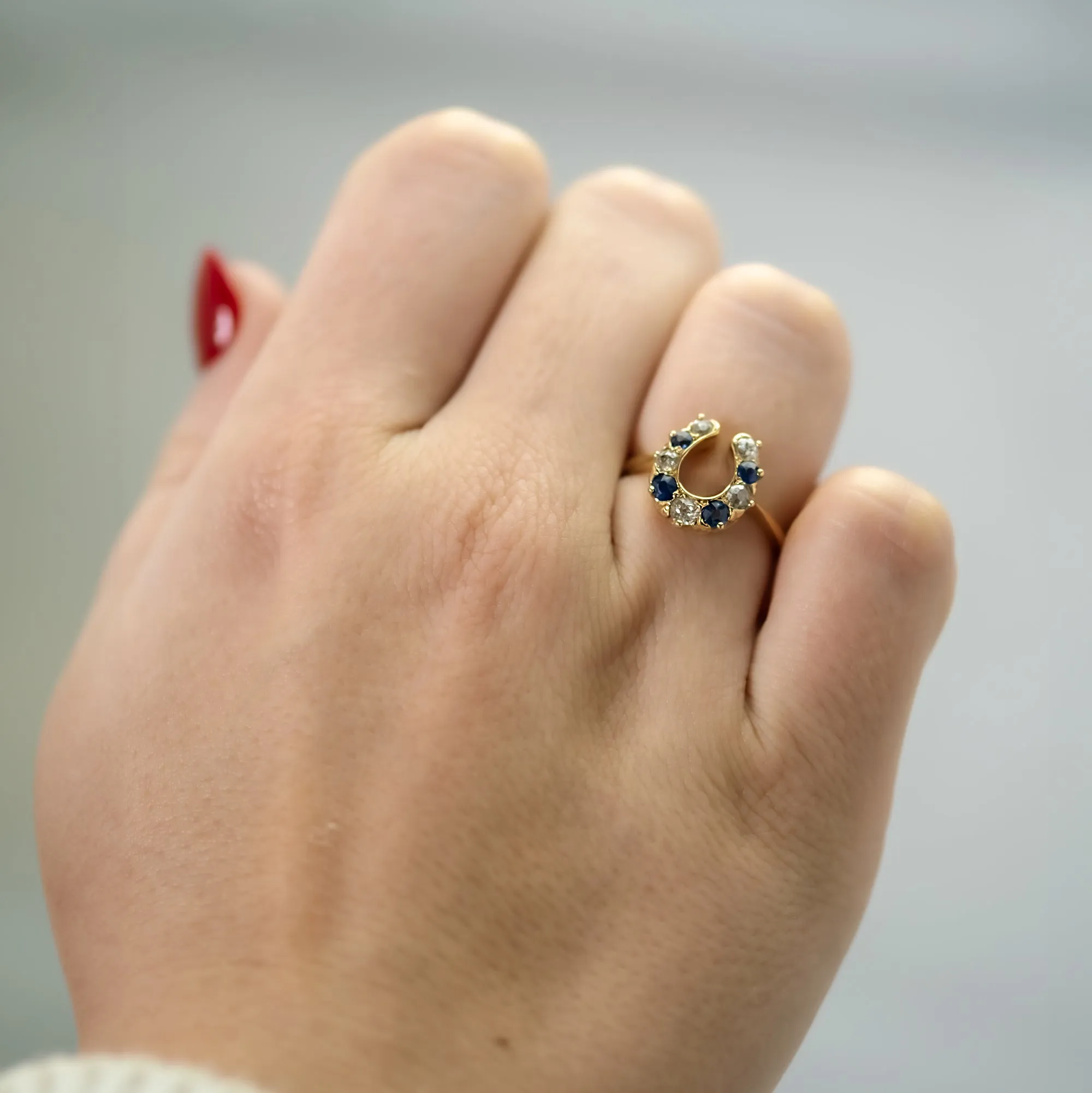 18 Carat Yellow Gold Sapphire and Diamond Horseshoe Ring